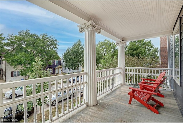 wooden terrace with a porch