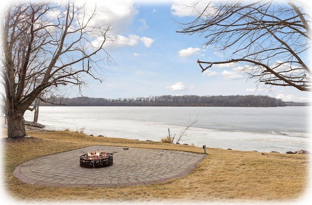 property view of water with an outdoor fire pit