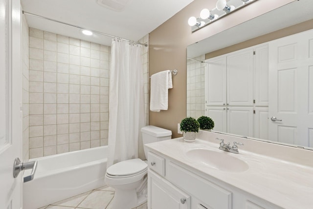 full bathroom with tile patterned flooring, toilet, vanity, and shower / bath combo