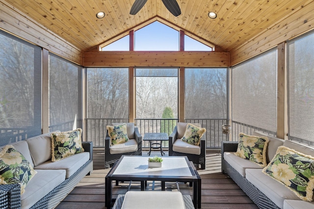 sunroom with lofted ceiling, wood ceiling, and ceiling fan