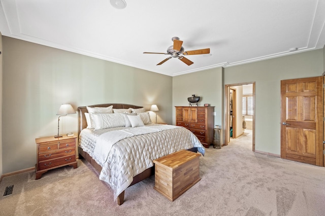 carpeted bedroom with visible vents, baseboards, a ceiling fan, and crown molding