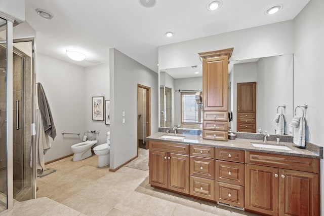 bathroom with a bidet, a stall shower, and a sink