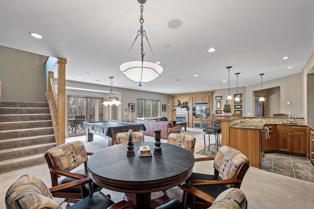 dining space with recessed lighting, light colored carpet, stairs, and billiards