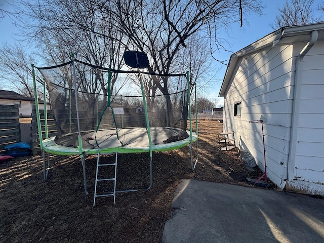 view of yard with a trampoline