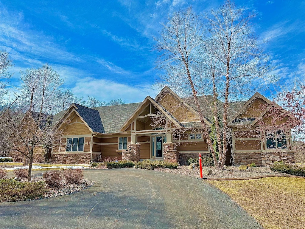 craftsman house with stone siding