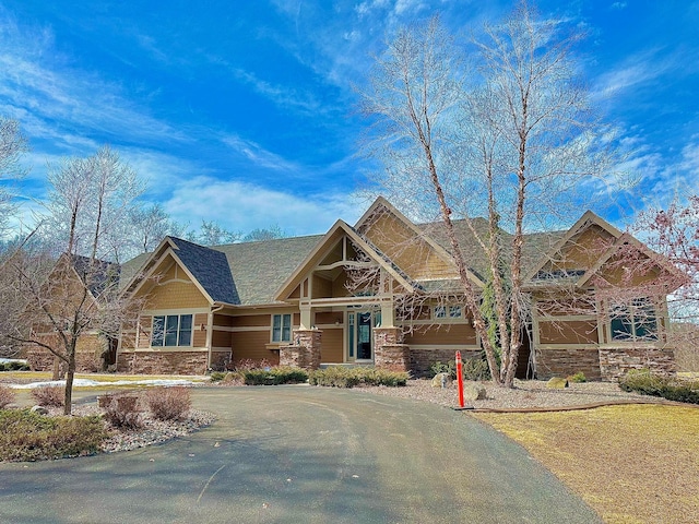 craftsman house with stone siding