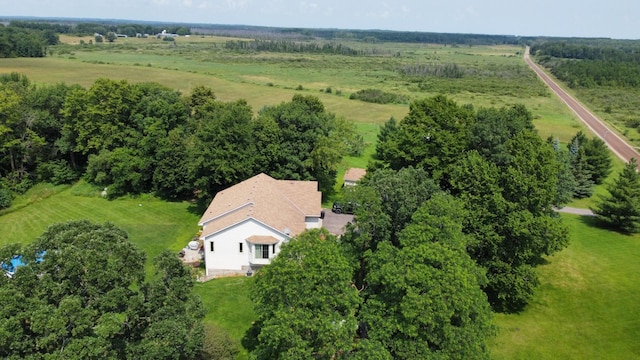 birds eye view of property with a rural view