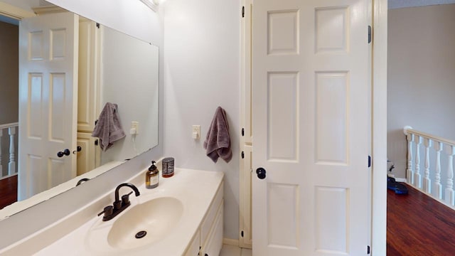 bathroom featuring vanity and wood finished floors