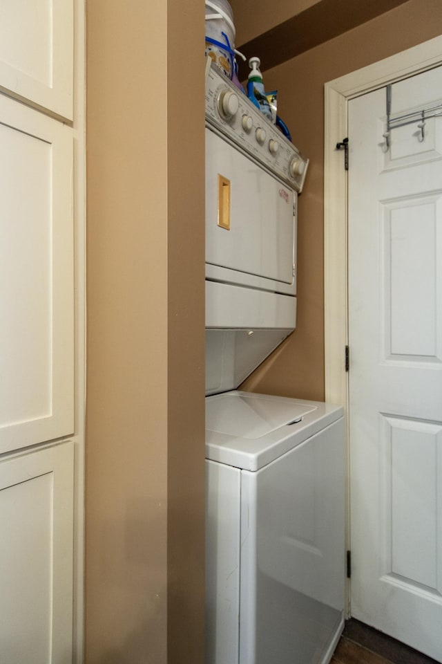 laundry room featuring stacked washer / dryer