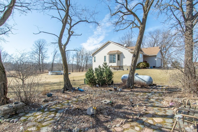 view of side of home featuring a yard