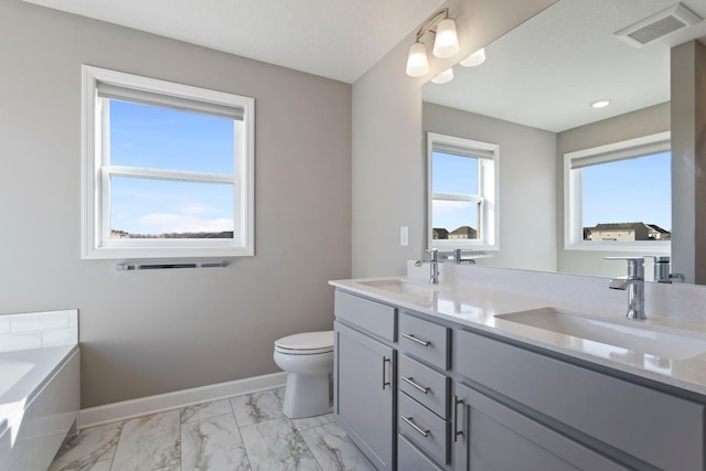 bathroom with visible vents, baseboards, toilet, marble finish floor, and a sink