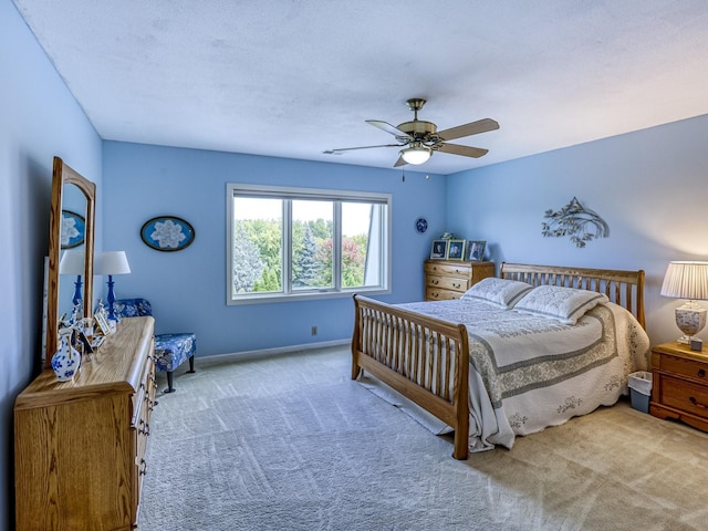 8621 Basswood Rd Unit 33, Eden Prairie, MN 55344 - carpeted bedroom featuring baseboards and a ceiling fan