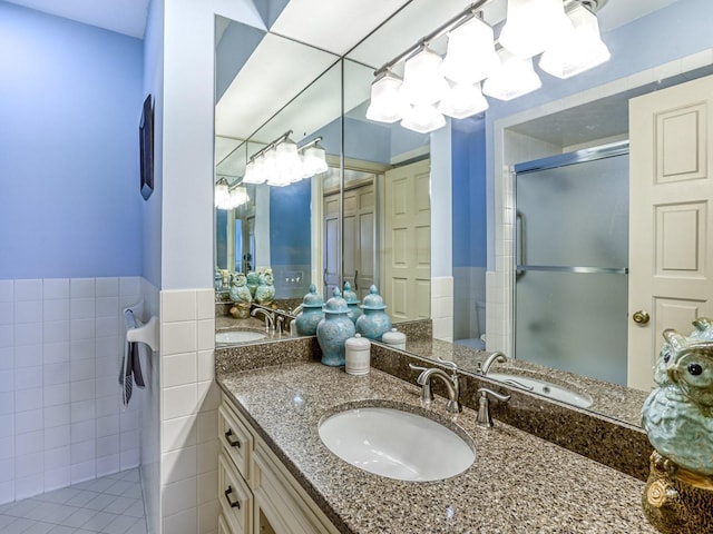 8621 Basswood Rd Unit 33, Eden Prairie, MN 55344 - full bathroom featuring tile walls, a stall shower, an inviting chandelier, and vanity