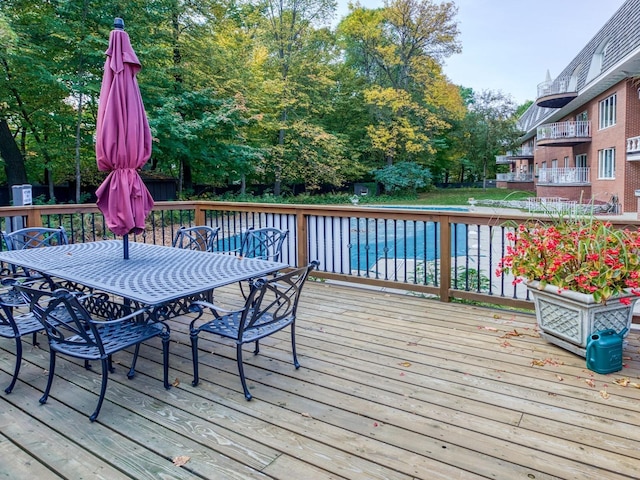8621 Basswood Rd Unit 33, Eden Prairie, MN 55344 - wooden terrace featuring outdoor dining area