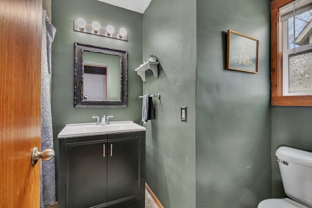 bathroom with toilet and vanity