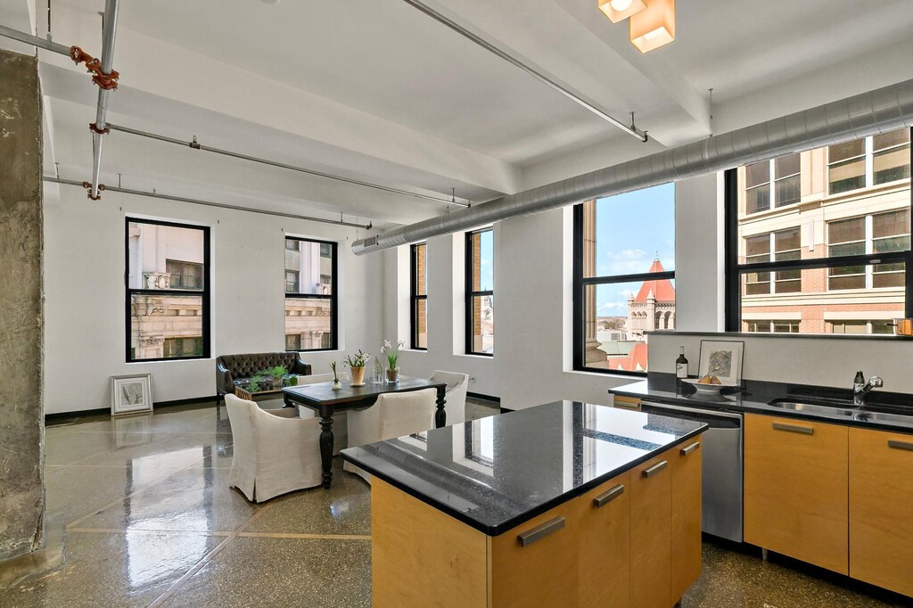 350 Saint Peter St Unit 1101, Saint Paul, MN 55102 - kitchen featuring beamed ceiling, dishwasher, a kitchen island, a sink, and open floor plan