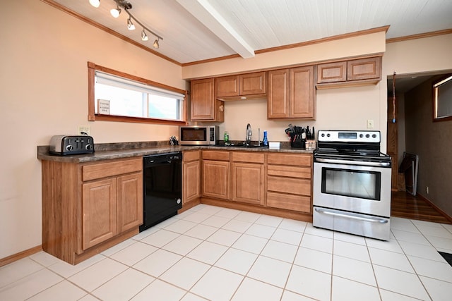 kitchen with light tile patterned floors, a sink, crown molding, appliances with stainless steel finishes, and dark countertops