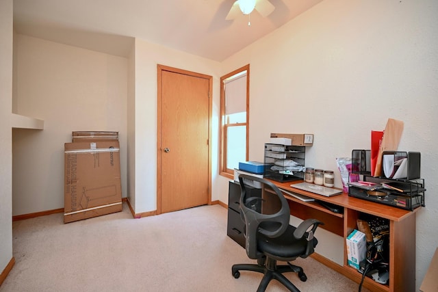 office space featuring carpet, baseboards, and ceiling fan