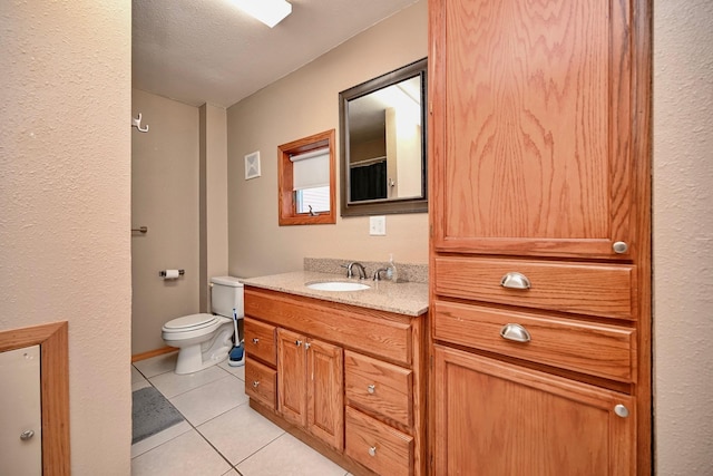 full bathroom featuring visible vents, toilet, vanity, tile patterned floors, and a textured ceiling