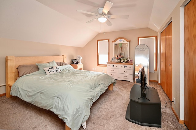 bedroom featuring baseboards, carpet, a ceiling fan, and vaulted ceiling