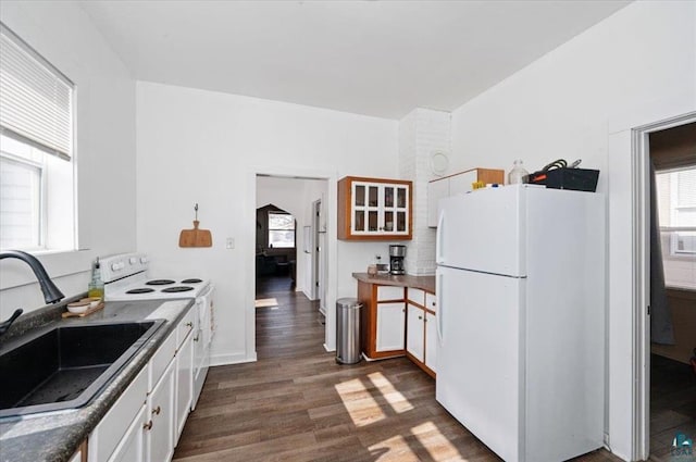 kitchen featuring white cabinetry, white appliances, dark wood-style floors, and a sink