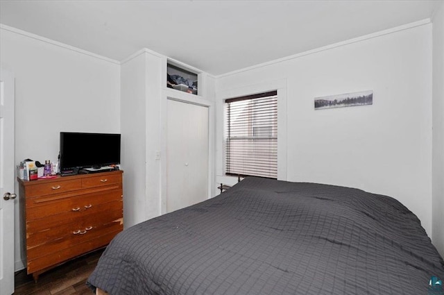 bedroom featuring dark wood-style floors and crown molding