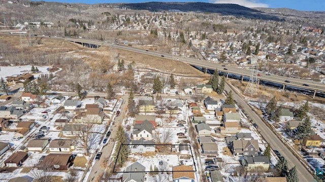 drone / aerial view with a mountain view and a residential view