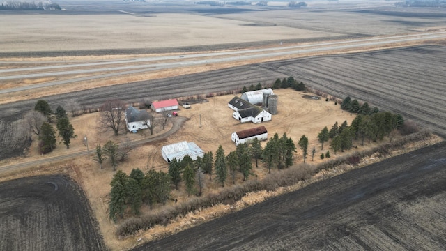 birds eye view of property with a rural view