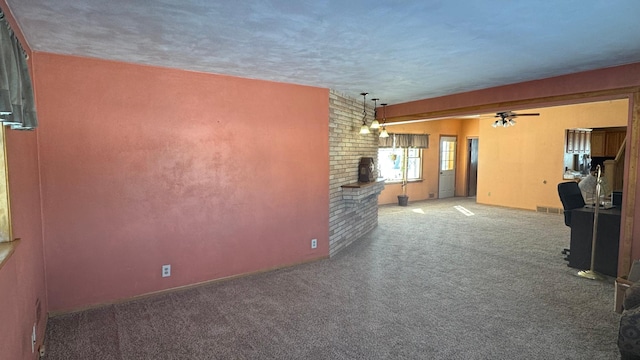 unfurnished room featuring a ceiling fan, carpet, and visible vents