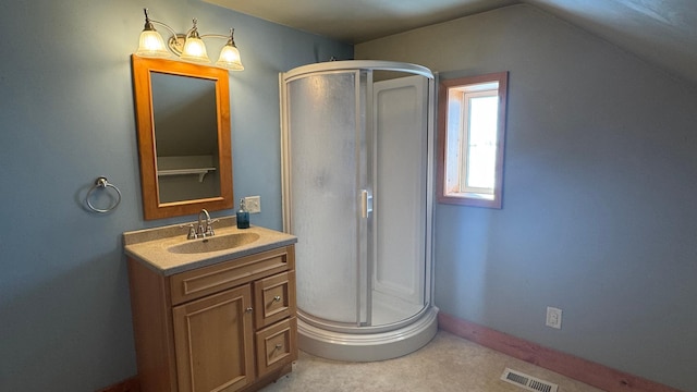 bathroom featuring visible vents, a shower stall, vanity, and baseboards