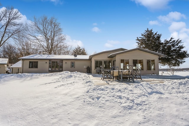 view of snow covered house