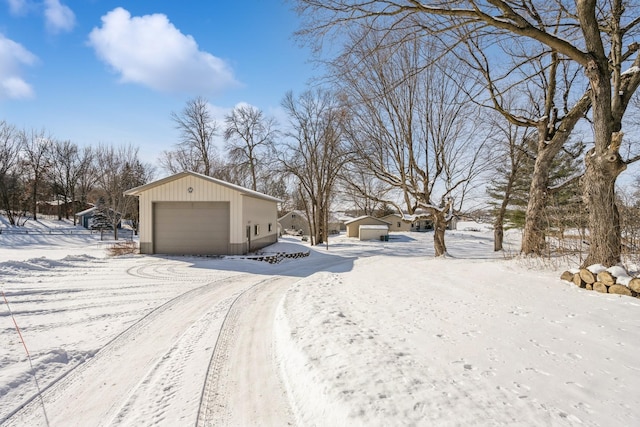 exterior space with an outbuilding and a garage