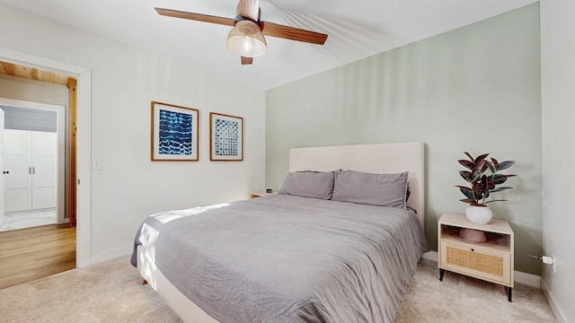 bedroom featuring baseboards, carpet, and a ceiling fan