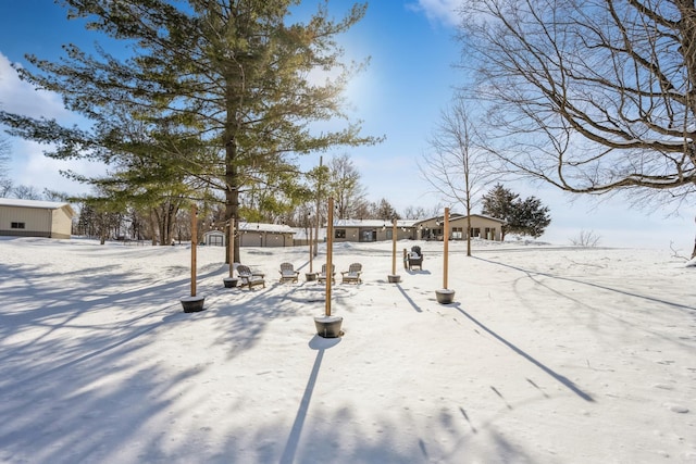 view of yard covered in snow