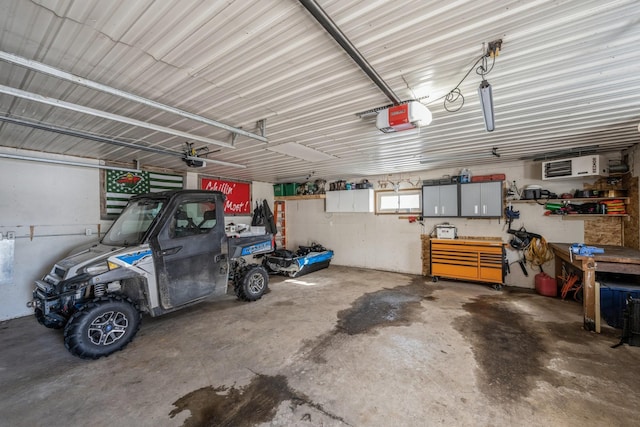 garage featuring metal wall and a garage door opener