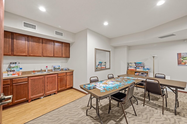 dining area featuring recessed lighting, light wood finished floors, and visible vents