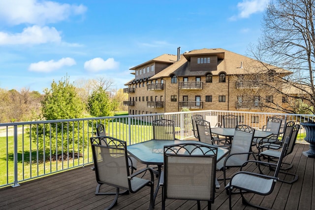 wooden terrace with outdoor dining space