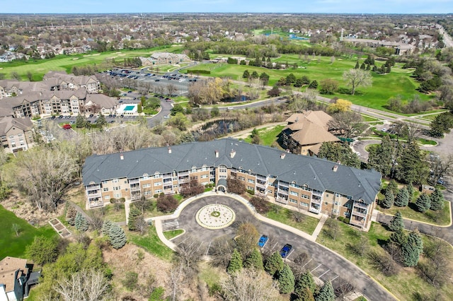 birds eye view of property with view of golf course