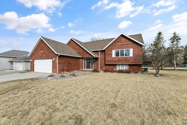 view of front of house featuring concrete driveway, an attached garage, a front lawn, and roof with shingles