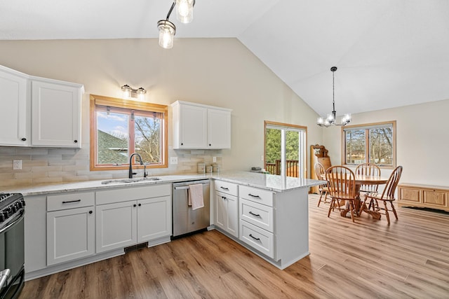 kitchen featuring white cabinetry, an inviting chandelier, a peninsula, a sink, and dishwasher