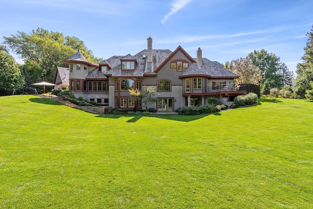 back of property featuring a lawn and a chimney