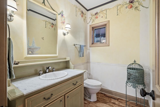 781 Ferndale Rd N, Orono, MN 55391 - half bath with toilet, visible vents, wood finished floors, and vanity