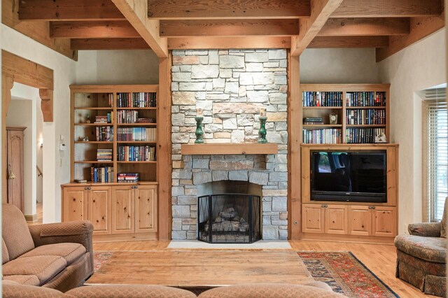 781 Ferndale Rd N, Orono, MN 55391 - living room with a fireplace, beamed ceiling, and wood finished floors