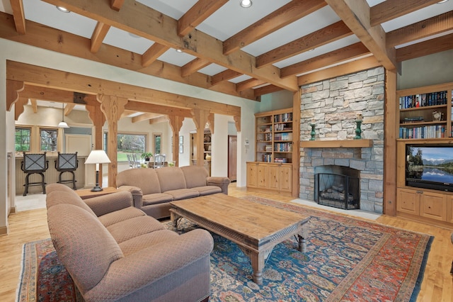 781 Ferndale Rd N, Orono, MN 55391 - living area with beamed ceiling, a stone fireplace, recessed lighting, and wood finished floors