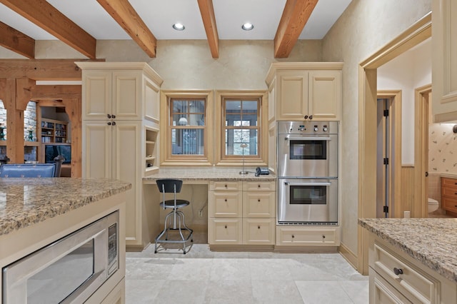 781 Ferndale Rd N, Orono, MN 55391 - kitchen featuring light stone countertops, appliances with stainless steel finishes, cream cabinetry, decorative backsplash, and beam ceiling