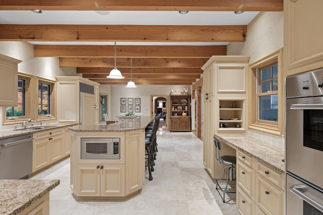 781 Ferndale Rd N, Orono, MN 55391 - kitchen featuring stainless steel appliances, a kitchen breakfast bar, beam ceiling, and cream cabinets