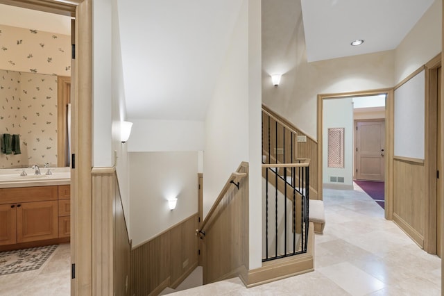 781 Ferndale Rd N, Orono, MN 55391 - stairs with a wainscoted wall and visible vents