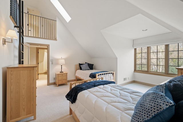 781 Ferndale Rd N, Orono, MN 55391 - bedroom with light colored carpet, visible vents, baseboards, and vaulted ceiling with skylight