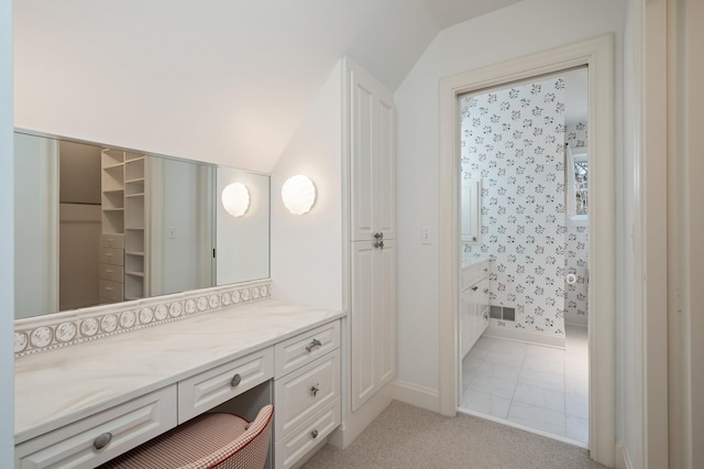 781 Ferndale Rd N, Orono, MN 55391 - bathroom featuring baseboards, vanity, visible vents, and vaulted ceiling