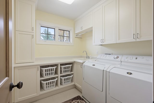 781 Ferndale Rd N, Orono, MN 55391 - clothes washing area with a sink, cabinet space, washing machine and dryer, and light tile patterned floors